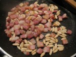 the pancetta i fried seperately. no need for oil as it's fat enough anyways ;) when it got crispy i added the pine nuts, but only for a short time (attention, they are fat so burn easily). add it to the big pan.