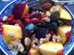 healthy breakfast with summer fruits, nuts and berries